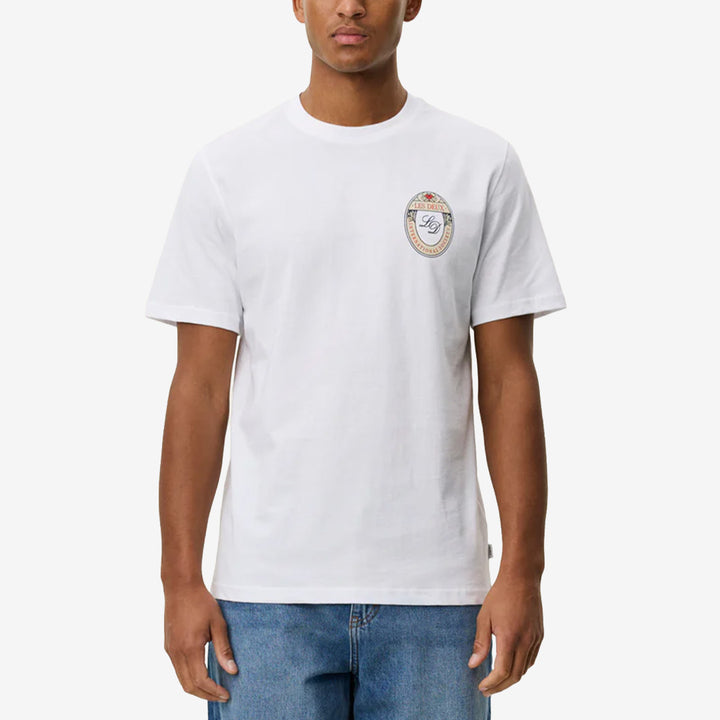 Vit t-shirt Brady Emblem i ekologisk bomull med blomemblem på bröstet