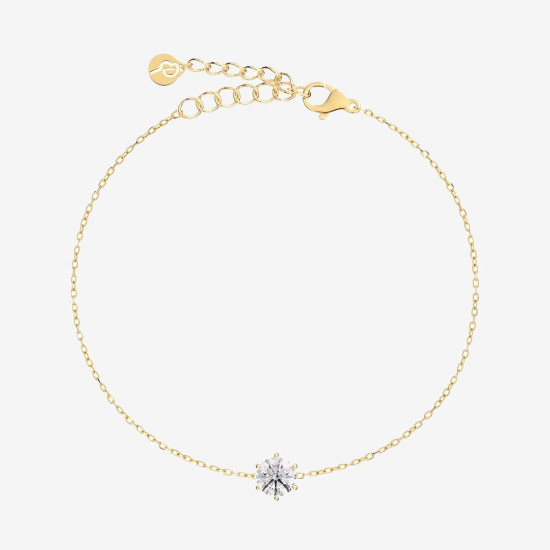 Alt text
Crown armband i blank 14K guldplätering med klar sten infattad i sex klor