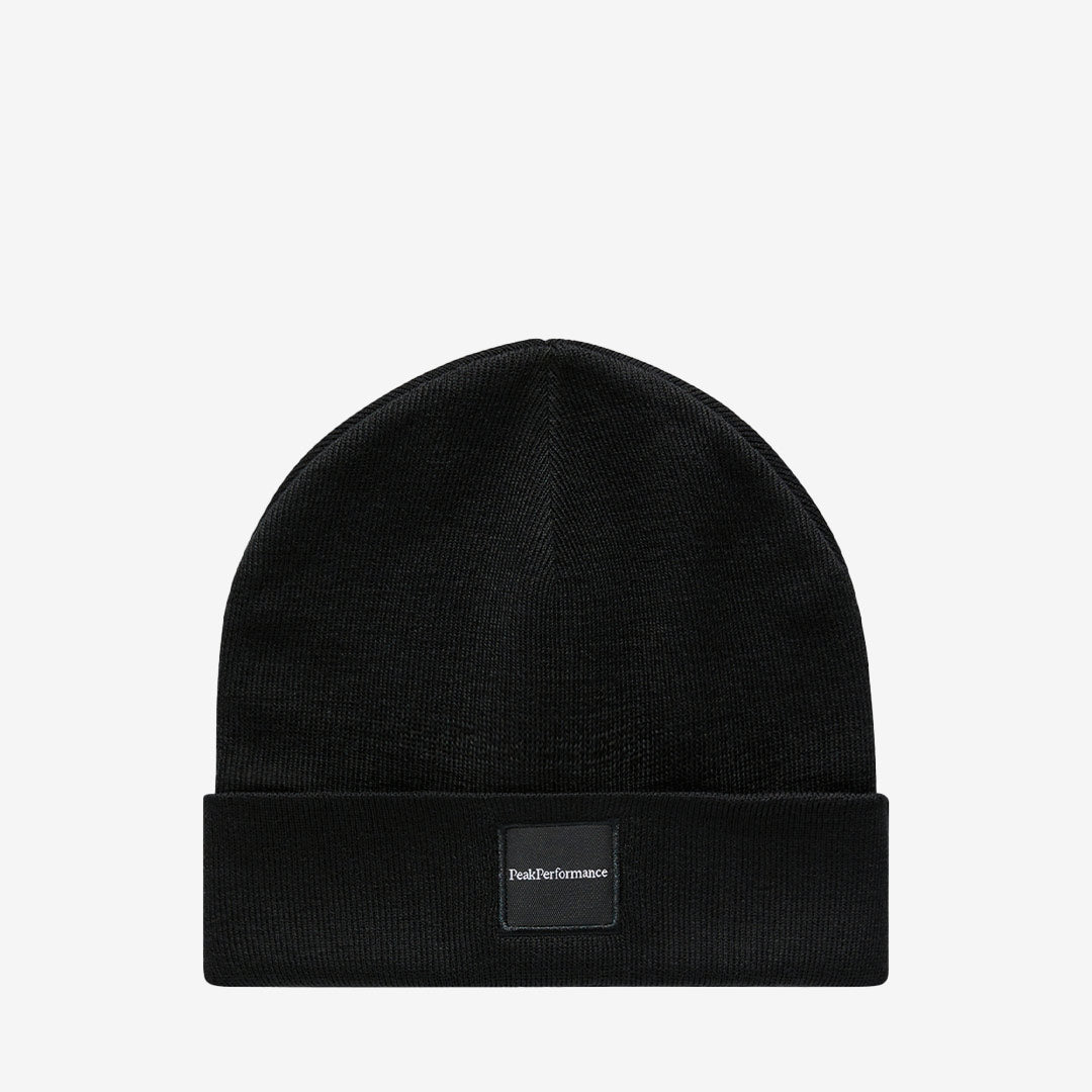 Peak Performance Switch Hat mössa i svart med 50% merinoull och stickad konstruktion.