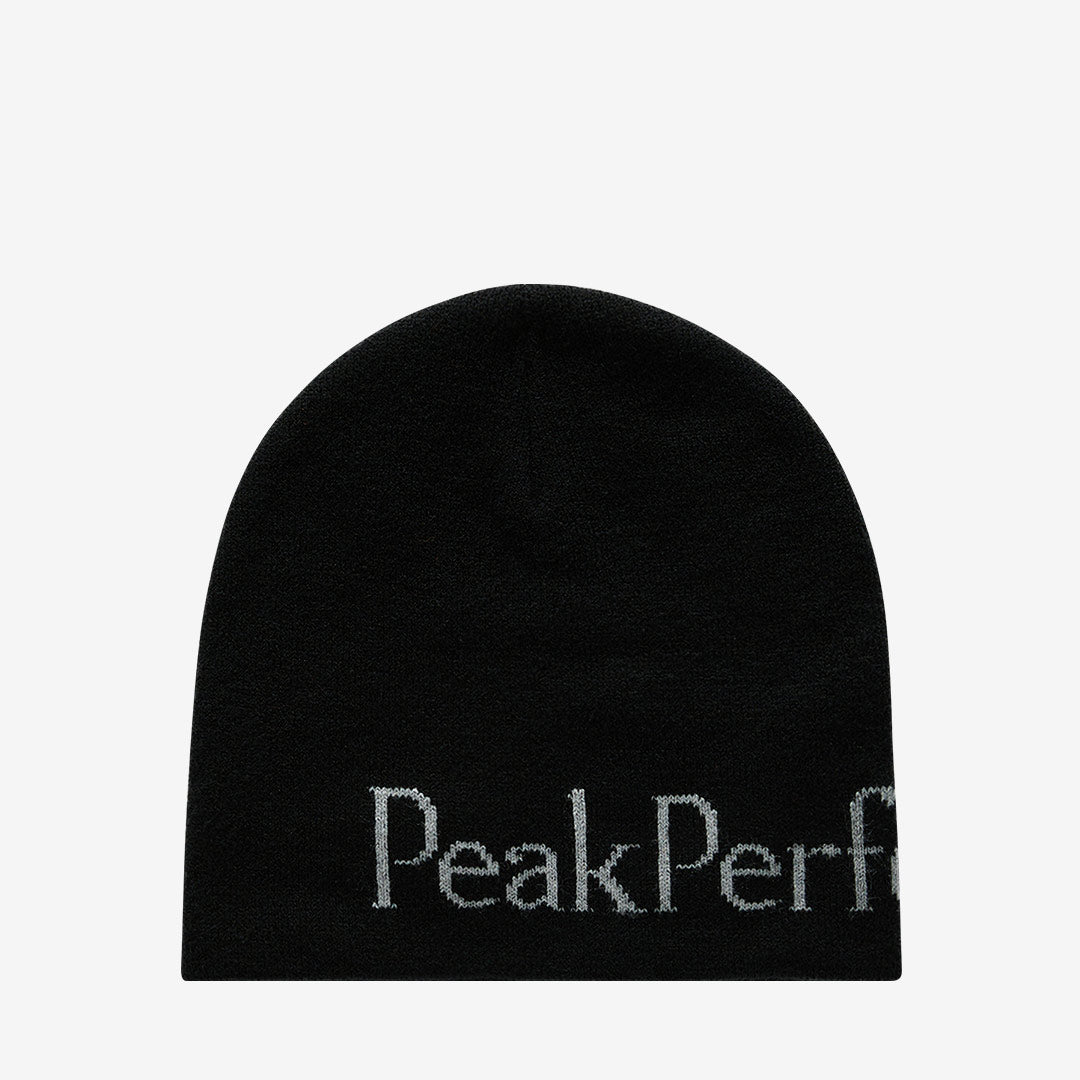 Peak Performance ribbstickad mössa i Black/Lt Grey med klassiskt mönster och Peak Performance-logga framtill.